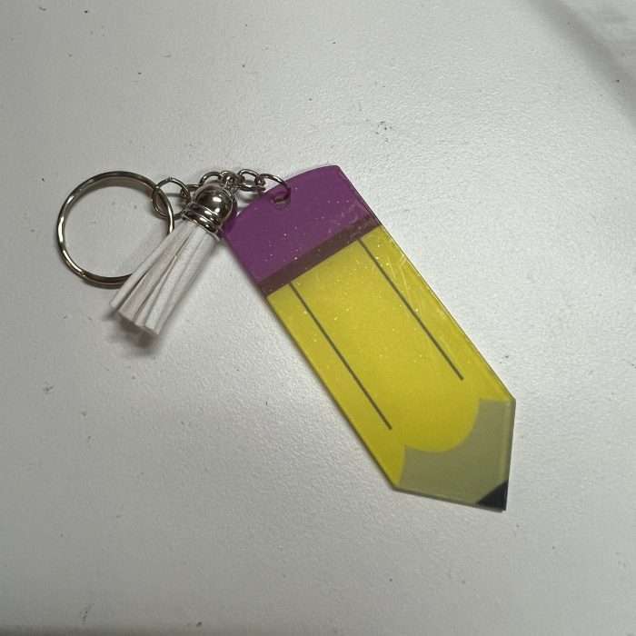 Colorful acrylic pencil keyring with a tassel accessory