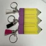 Acrylic pencil keyring with colorful tassels in pink, black, white